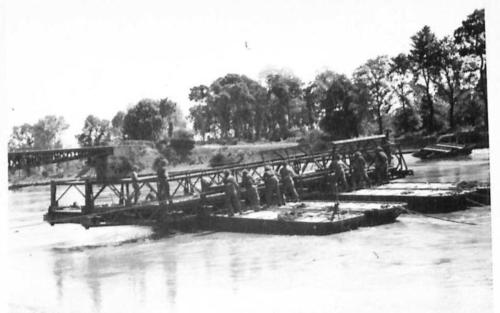 THE BRITISH ARMY IN THE NORMANDY CAMPAIGN 1944 - Royal Engineers constructing a pontoon bridge across the River Orne, close by 'Horsa Bridge' near Ranville, 8 June 1944. The bridge was captured by 6th Airborne Division in the early hours of D-Day