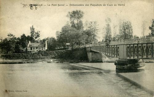 image E01 033R-Ranville - Le pont fermé - Carte postale du 07 04 09